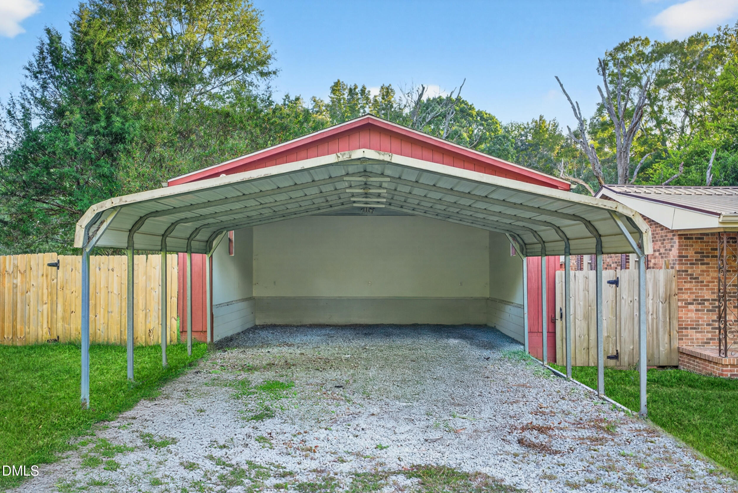 205 Bacon Road Rougemont, NC 27572 - Photo 5 of 29 a view of a wooden house with a yard