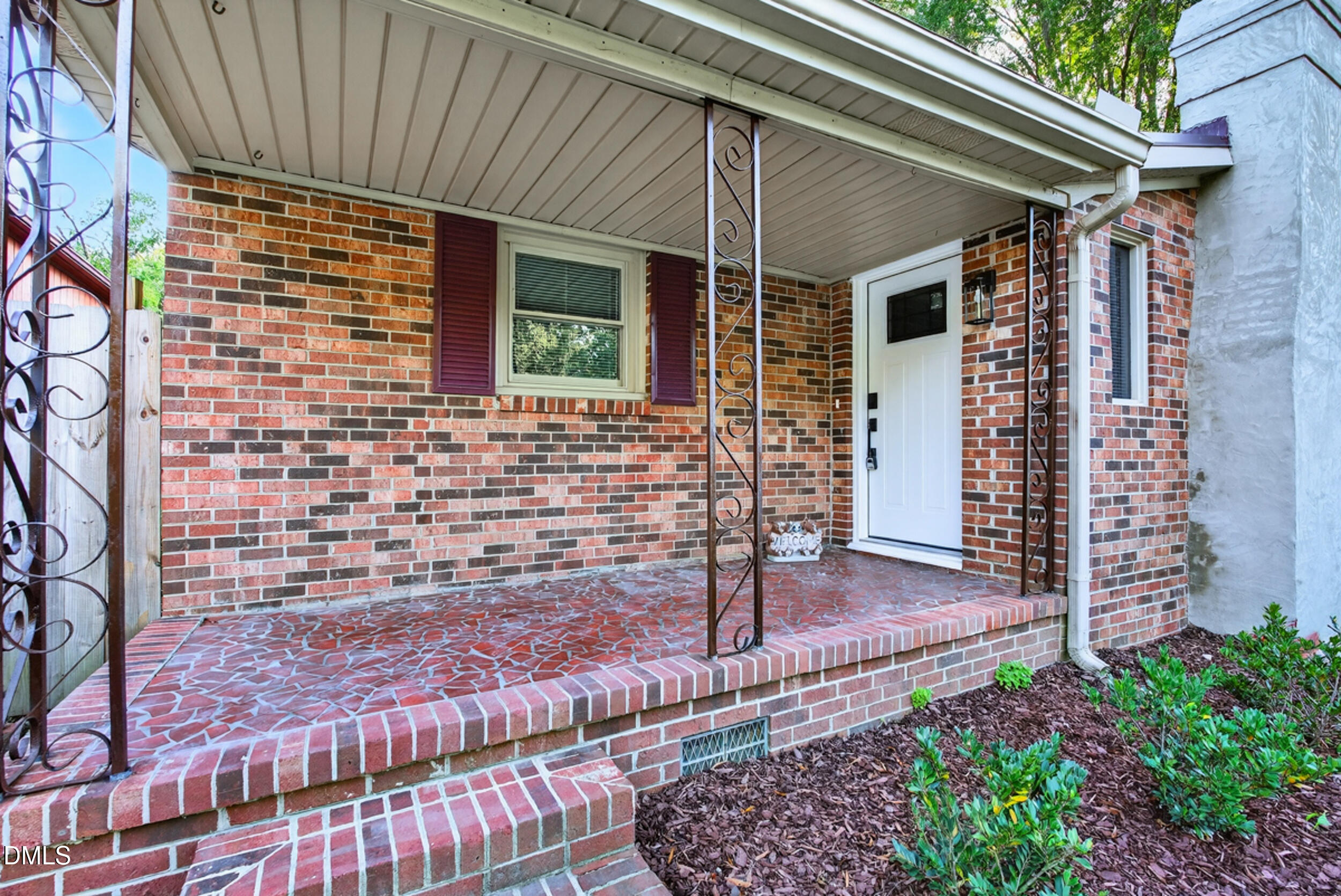 205 Bacon Road Rougemont, NC 27572 - Photo 6 of 29 a front view of a house with garden