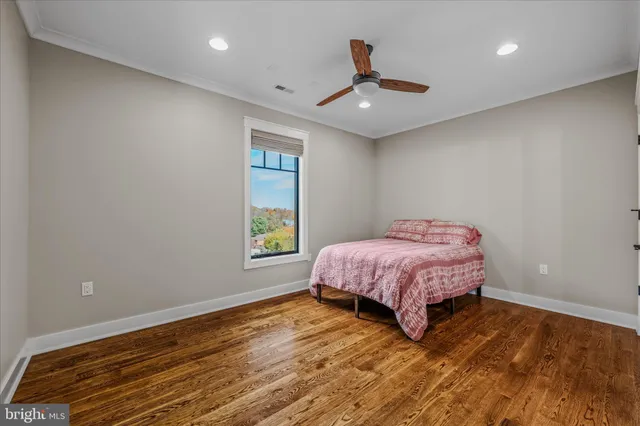 a room with pool table and windows