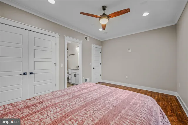 a room with pool table windows and wooden floor