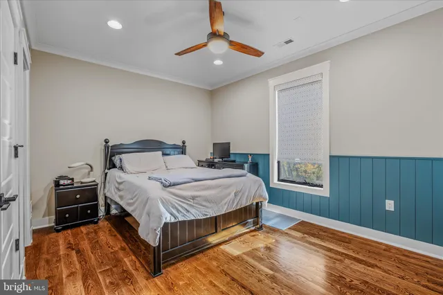a bedroom with furniture and a window