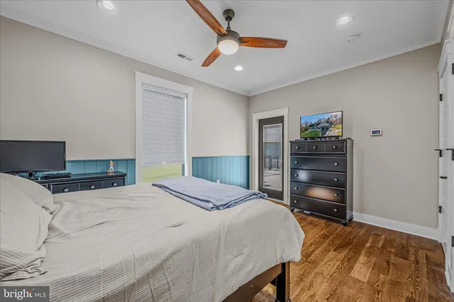 a spacious bedroom with a bed and a window