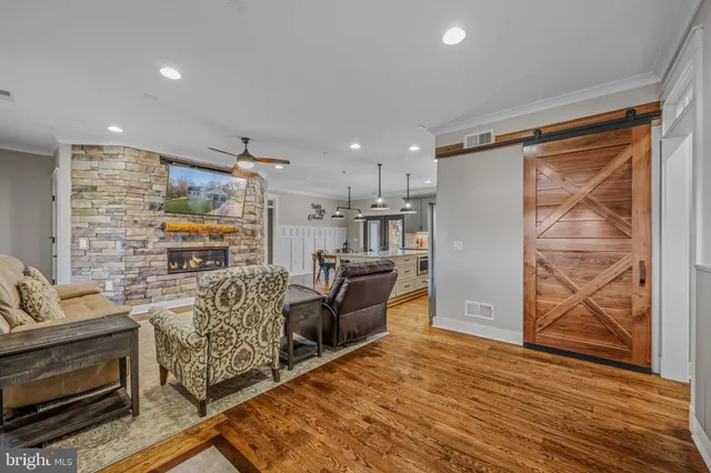 a large kitchen with a table and chairs