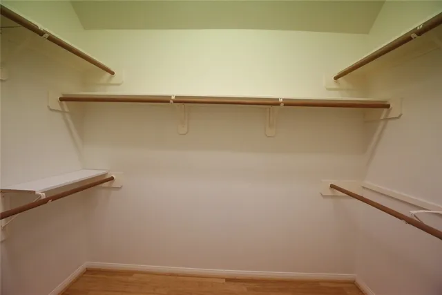 an empty room with closet area