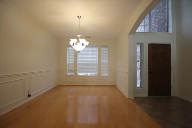 a bathroom with a granite countertop toilet and a sink