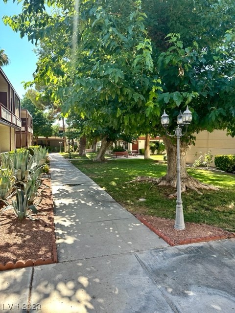 350 East Desert Inn Road, Unit E205 Las Vegas, NV 89109 - Photo 3 of 26 Mature Landscaping throughout Community