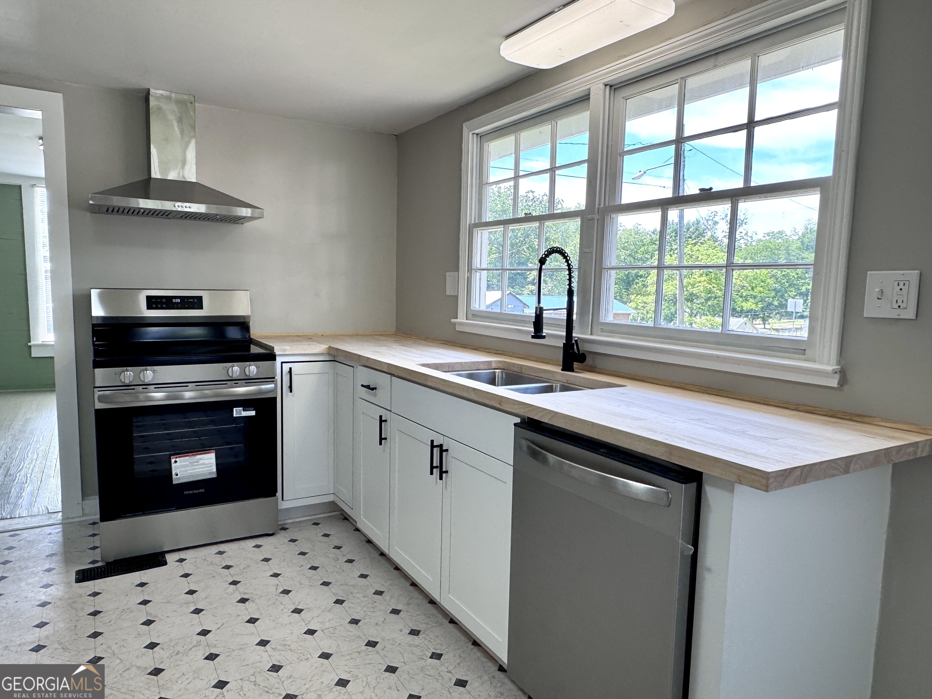 3608 Us Highway Buchanan, GA 30113 - Photo 1 of 51 a kitchen with a sink a stove and a microwave