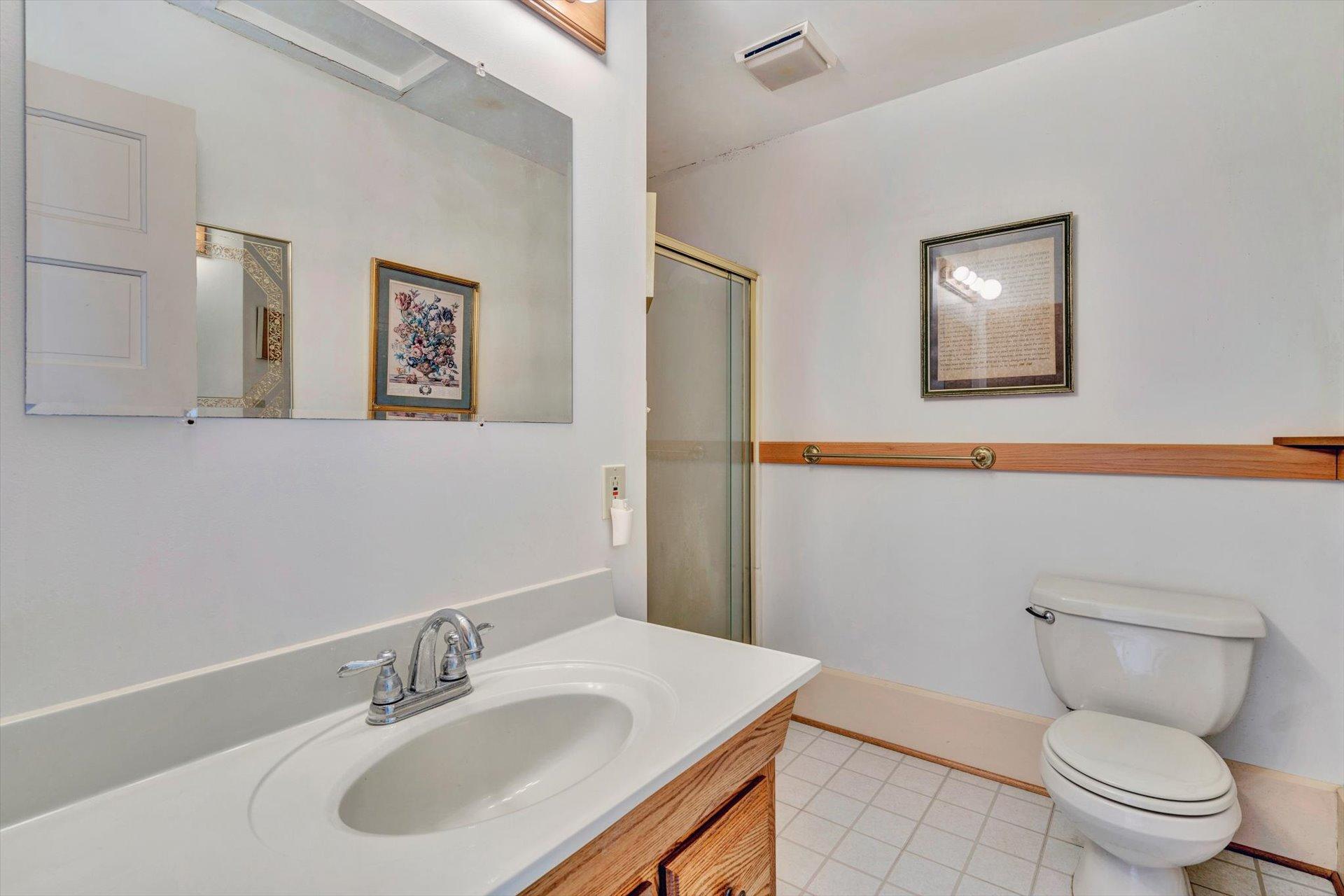 2501 Middlebrook Road Staunton, VA 24401 - Photo 29 of 50 a bathroom with a toilet sink and mirror