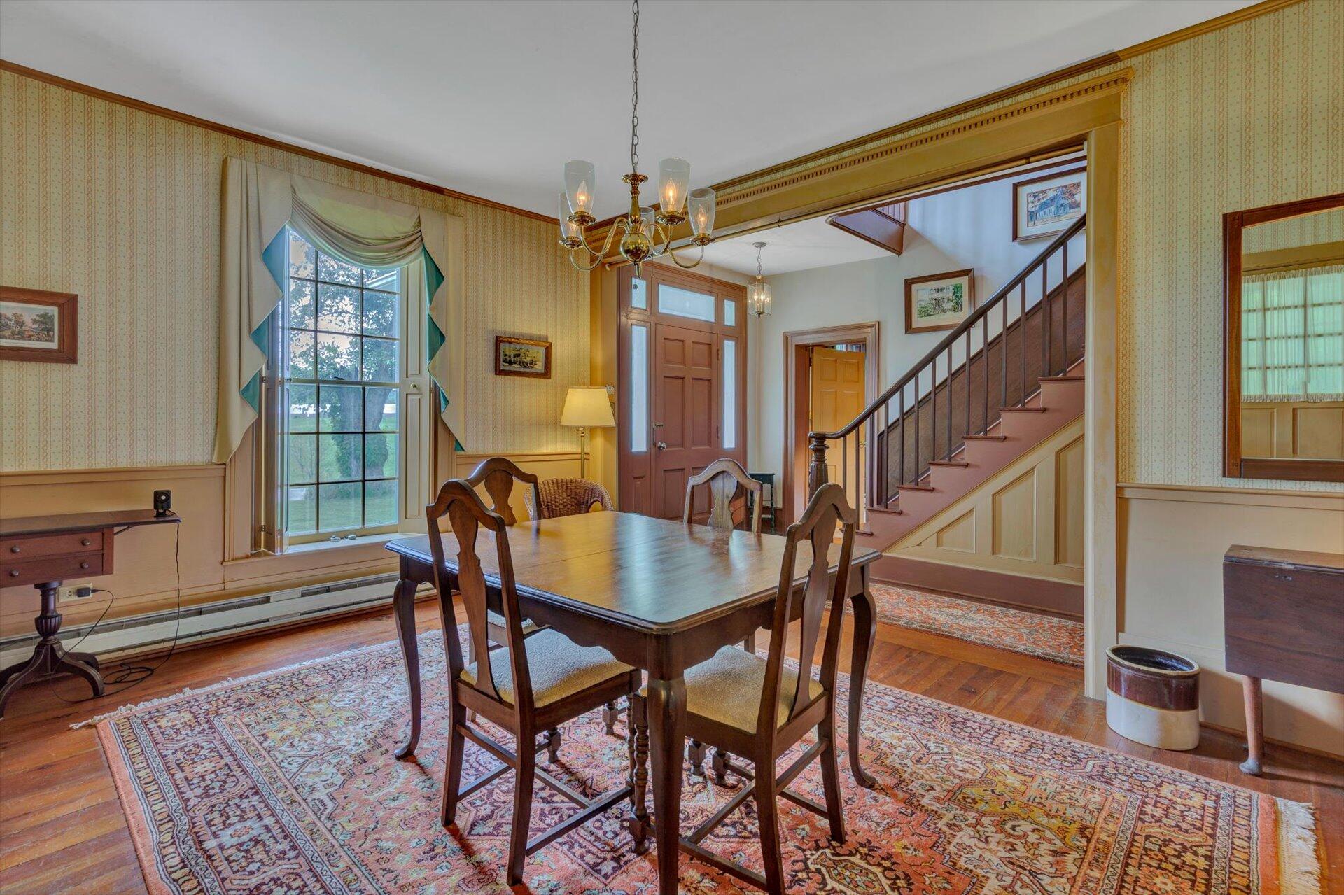 2501 Middlebrook Road Staunton, VA 24401 - Photo 6 of 50 a dining room with furniture a chandelier and wooden floor