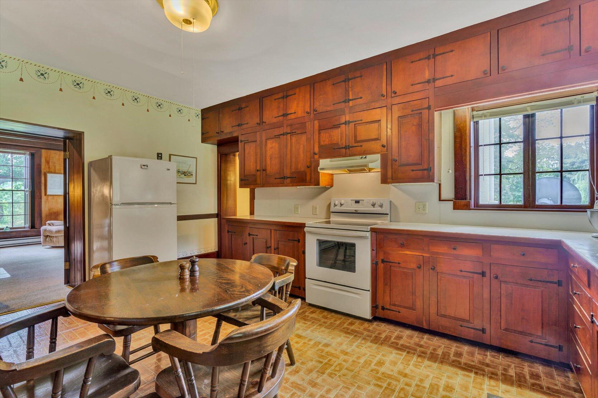 2501 Middlebrook Road Staunton, VA 24401 - Photo 10 of 50 a kitchen with stainless steel appliances granite countertop a sink dishwasher and cabinets with wooden floor