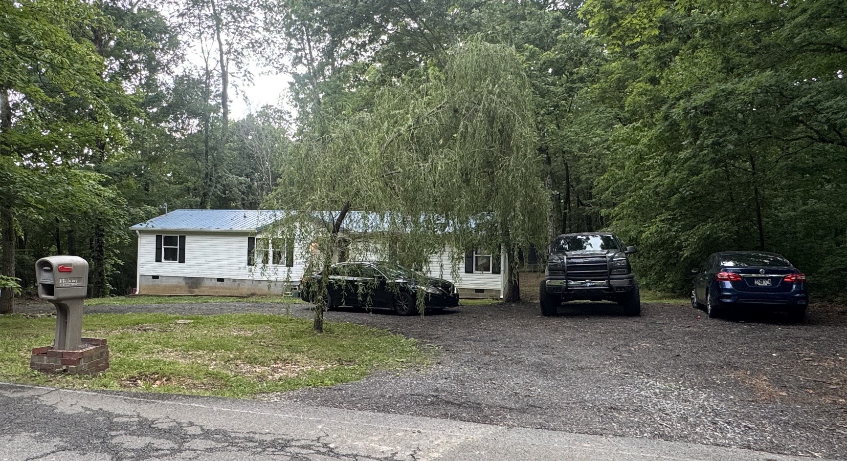 1009 Brummit Road Charlotte, TN 37036 - Photo 1 of 1 a view of a car in front of house