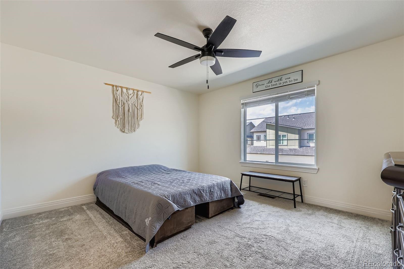 1835 Rose Quartz Heights Colorado Springs, CO 80908 - Photo 14 of 31 a bedroom with a bed and a window