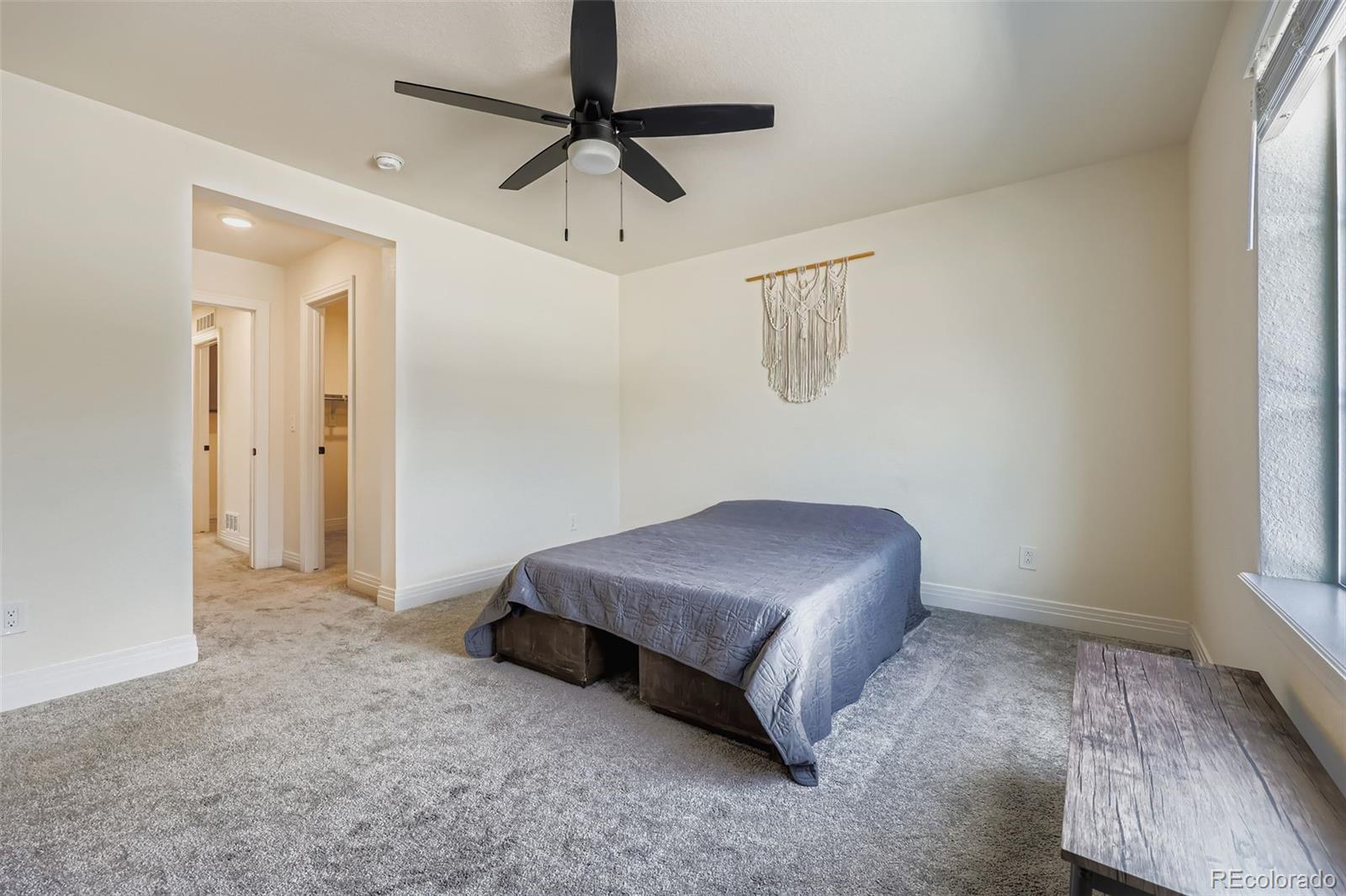 1835 Rose Quartz Heights Colorado Springs, CO 80908 - Photo 15 of 31 a living room with a bed furniture and a window