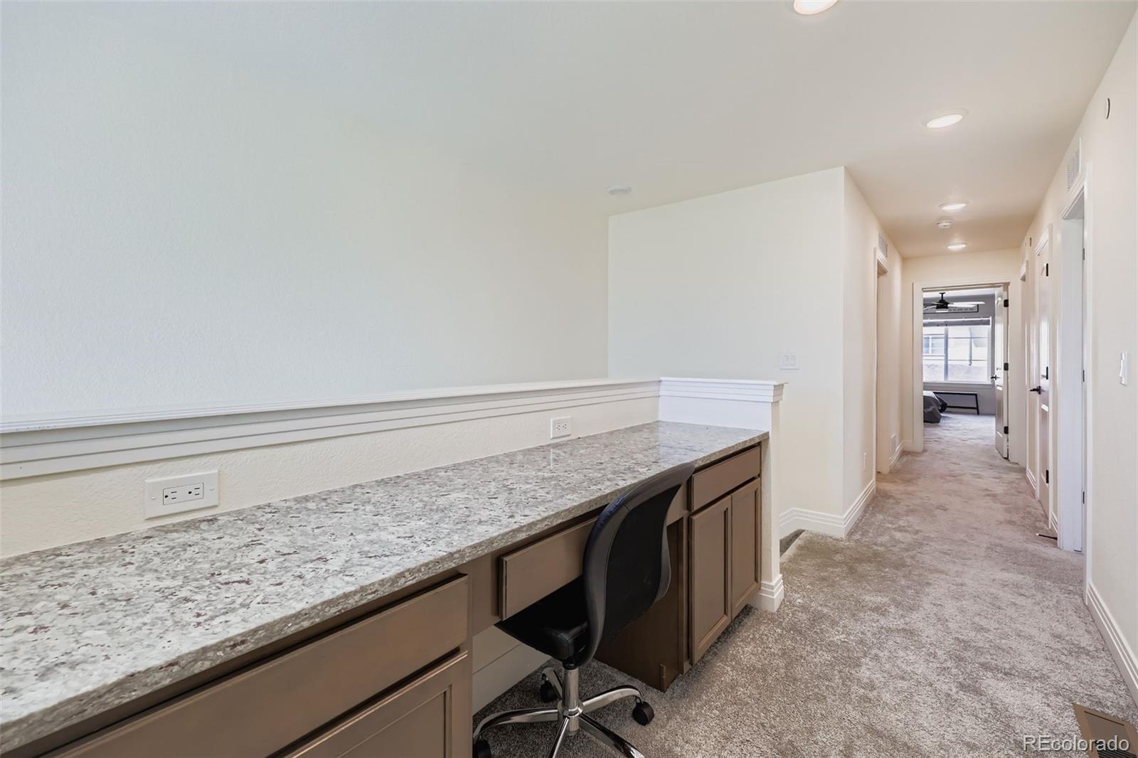 1835 Rose Quartz Heights Colorado Springs, CO 80908 - Photo 24 of 31 a kitchen with a sink and cabinets
