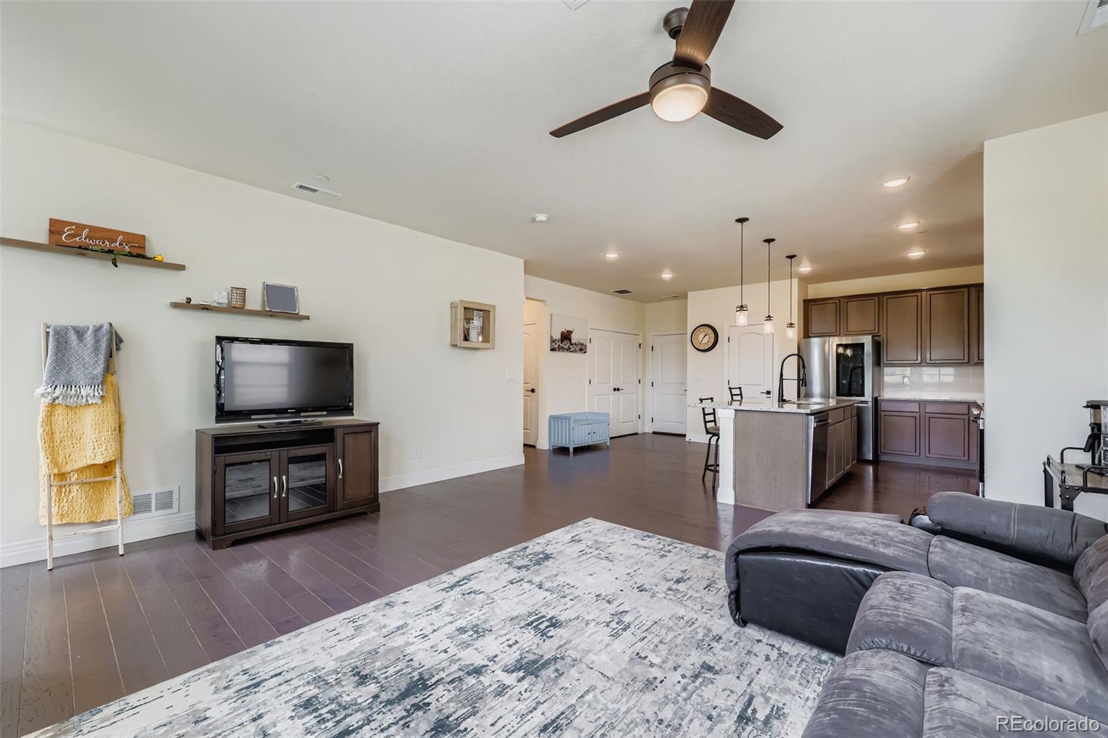 1835 Rose Quartz Heights Colorado Springs, CO 80908 - Photo 6 of 31 a living room with furniture and a flat screen tv