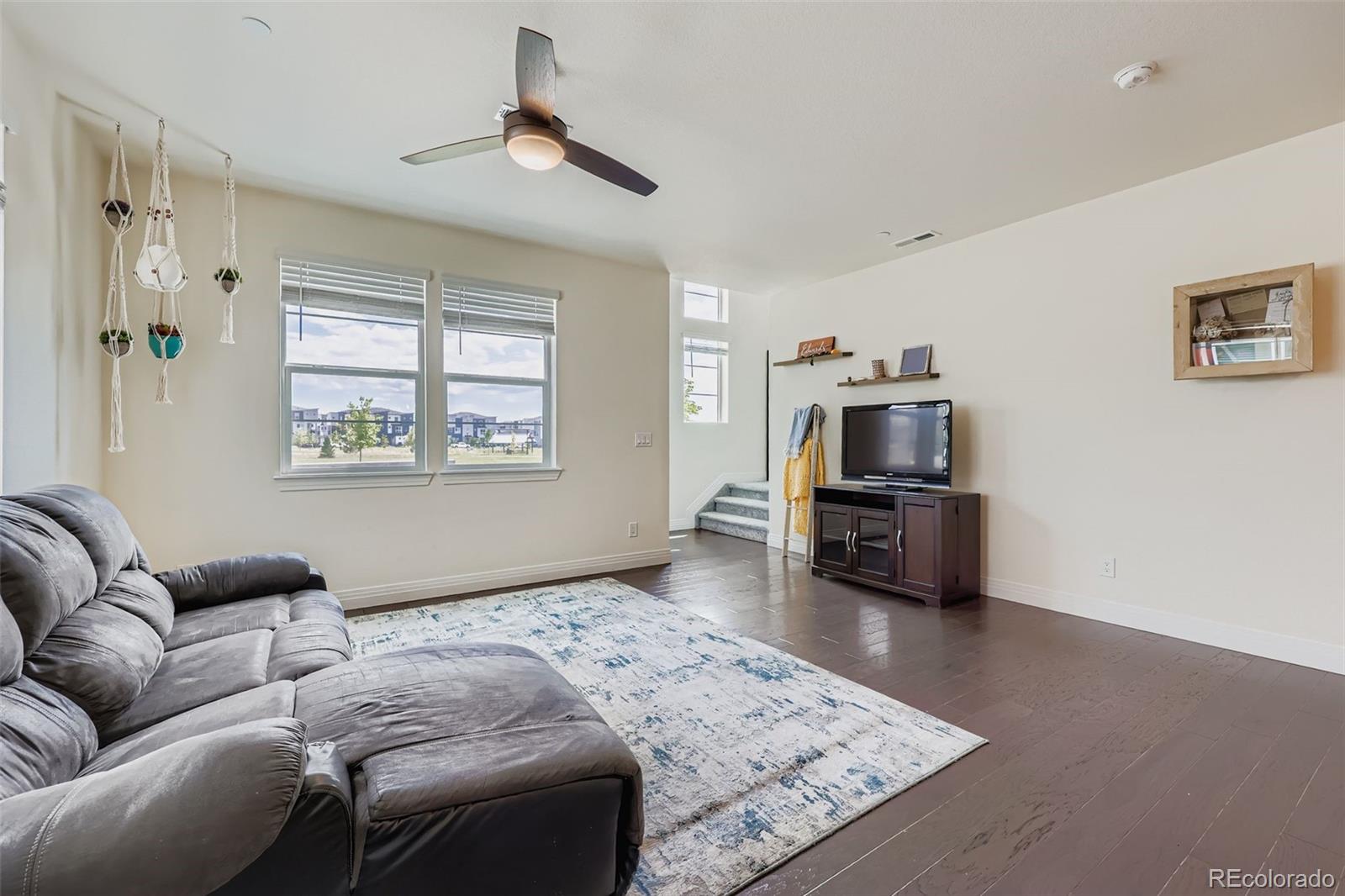1835 Rose Quartz Heights Colorado Springs, CO 80908 - Photo 7 of 31 a living room with furniture and a flat screen tv