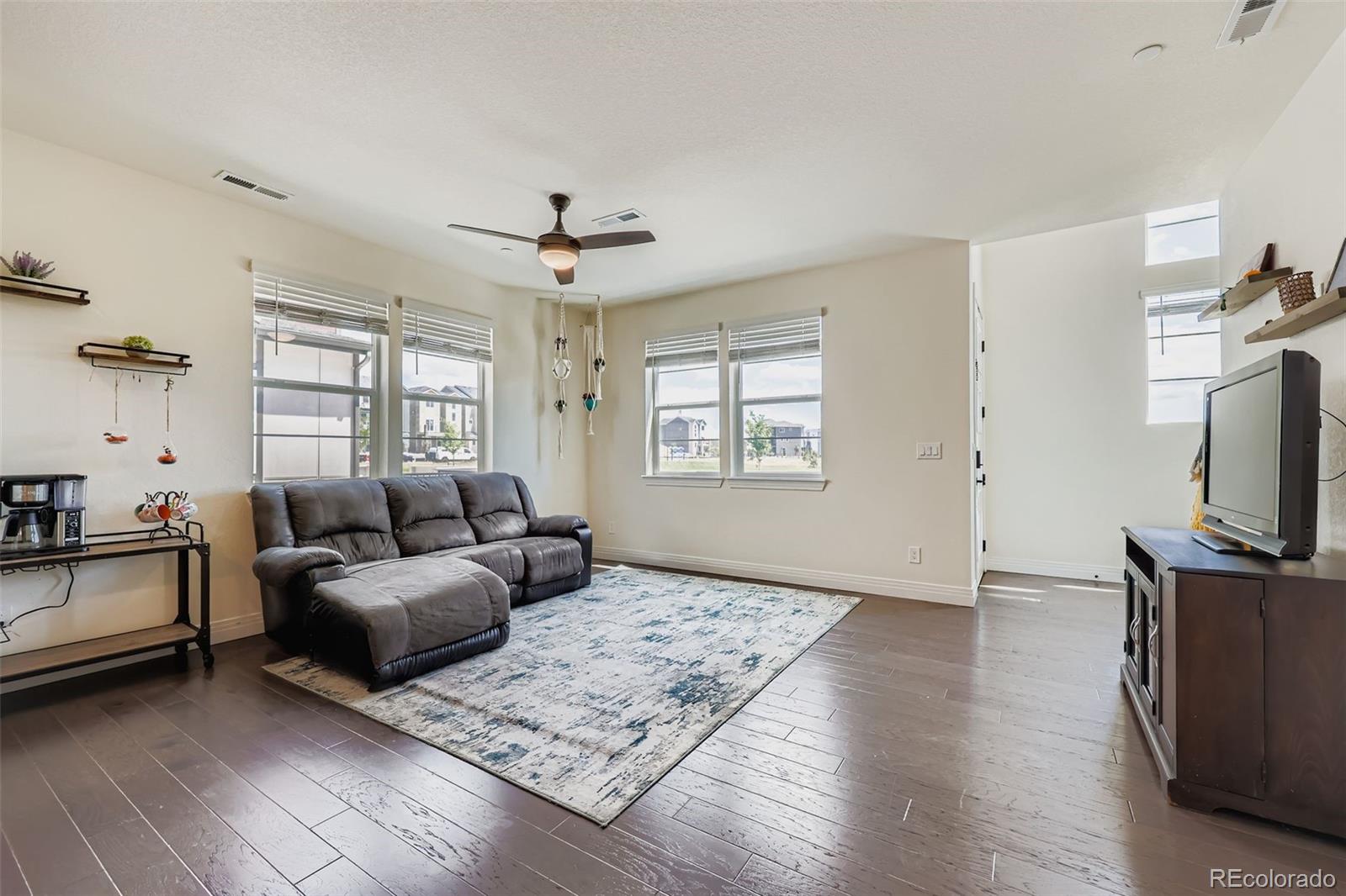 1835 Rose Quartz Heights Colorado Springs, CO 80908 - Photo 8 of 31 a living room with furniture and a flat screen tv