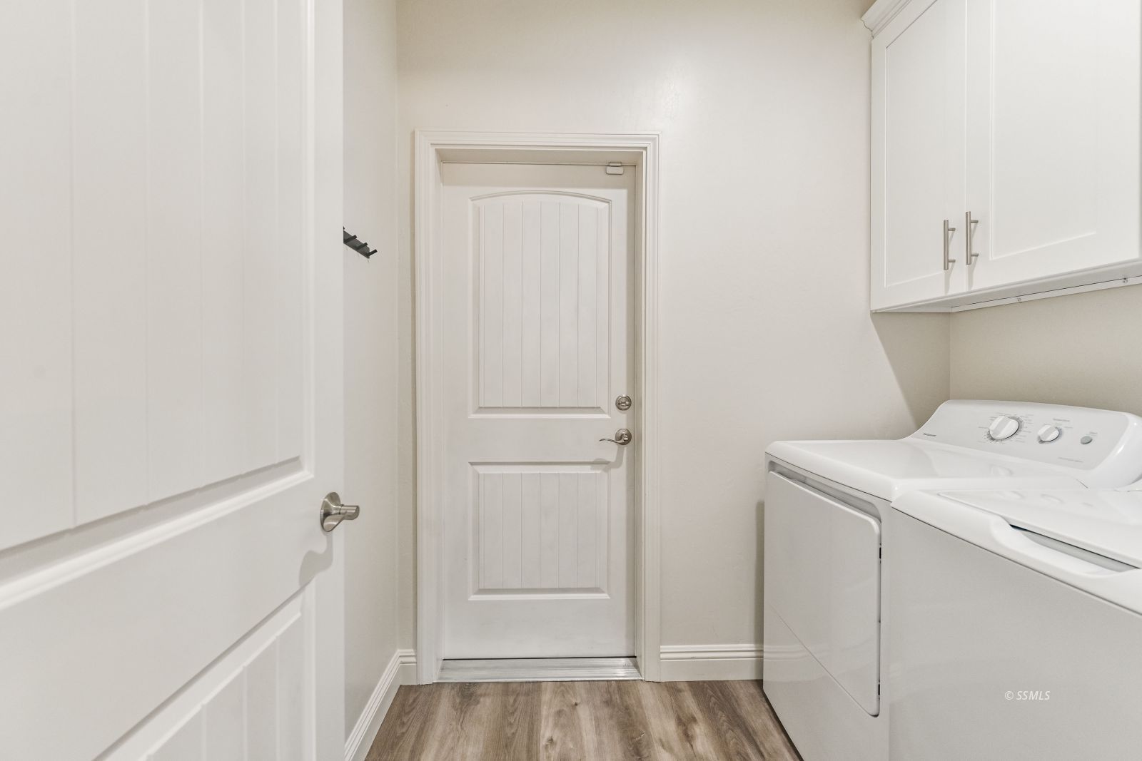 1031 West Church Avenue Ridgecrest, CA 93555 - Photo 22 of 49 a view of storage and utility room with washer and dryer
