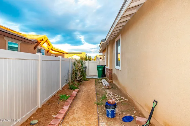 a outdoor living space with furniture and a fireplace