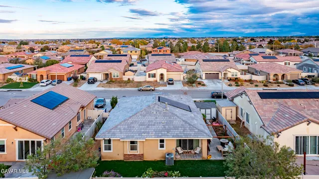 an aerial view of multiple house with a yard