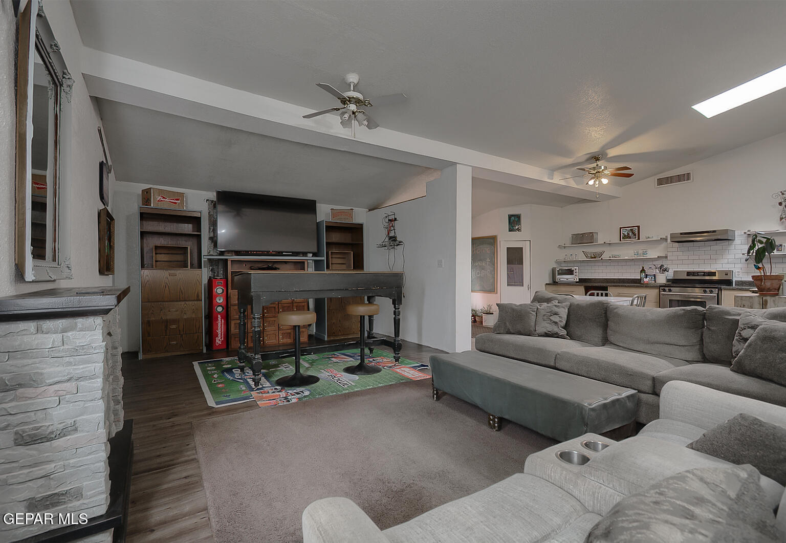 261 Indian Head Road Tornillo, TX 79853 - Photo 9 of 44 a living room with furniture and a fireplace