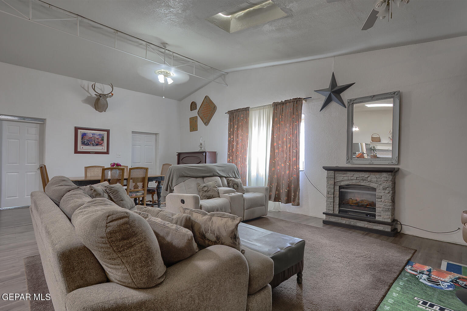 261 Indian Head Road Tornillo, TX 79853 - Photo 10 of 44 a living room with furniture a fireplace and a fireplace