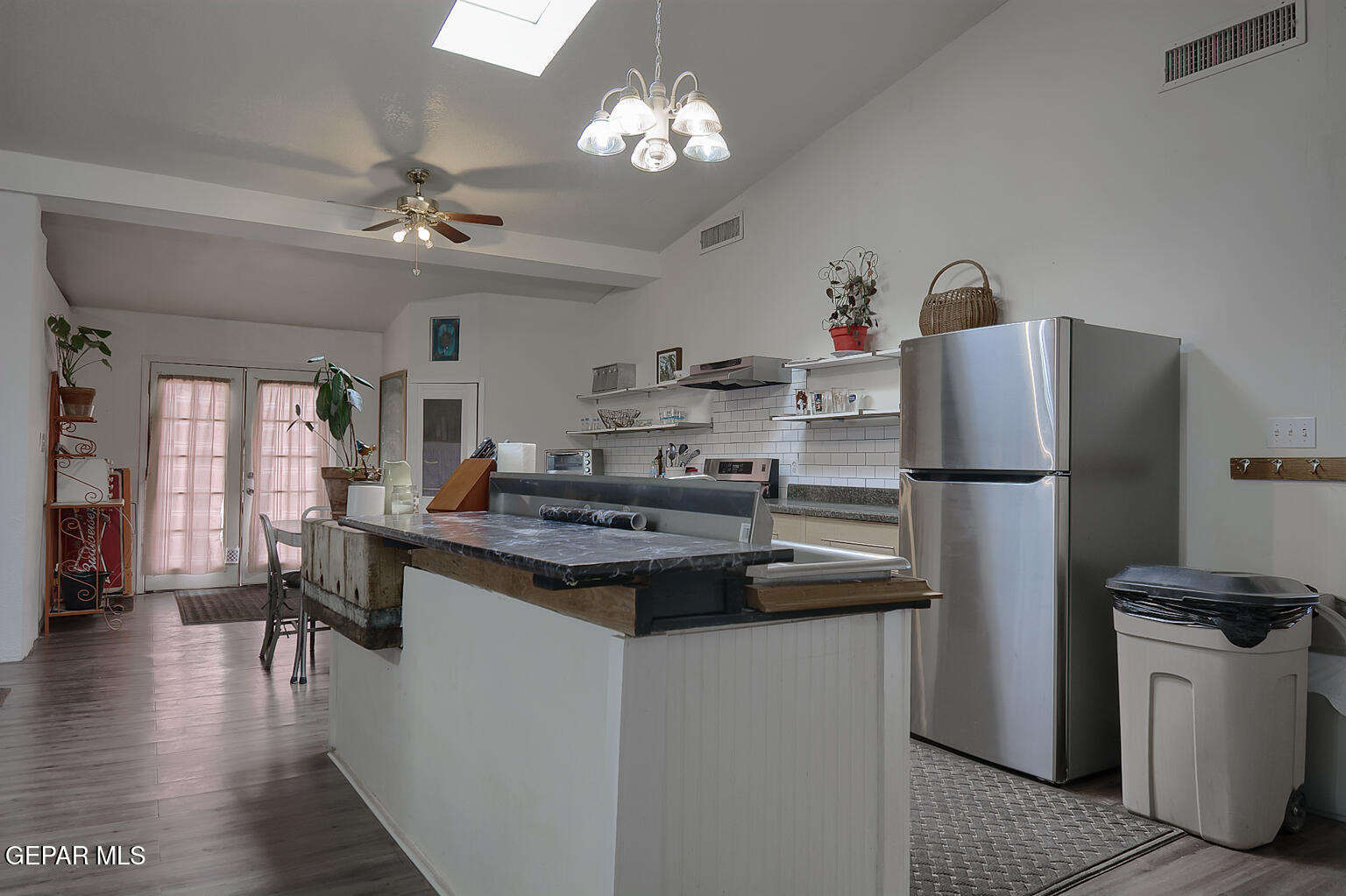 261 Indian Head Road Tornillo, TX 79853 - Photo 11 of 44 a kitchen with kitchen island a sink stove and refrigerator