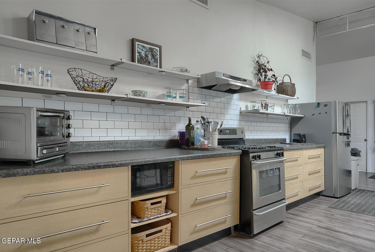 261 Indian Head Road Tornillo, TX 79853 - Photo 14 of 44 a kitchen with stainless steel appliances granite countertop a stove and cabinets
