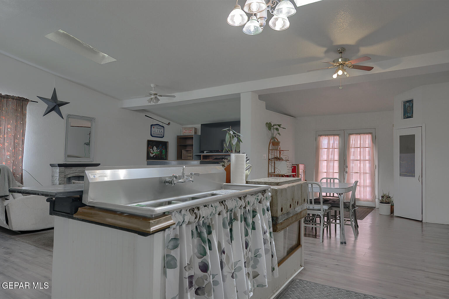 261 Indian Head Road Tornillo, TX 79853 - Photo 16 of 44 a kitchen with counter top space and a center island