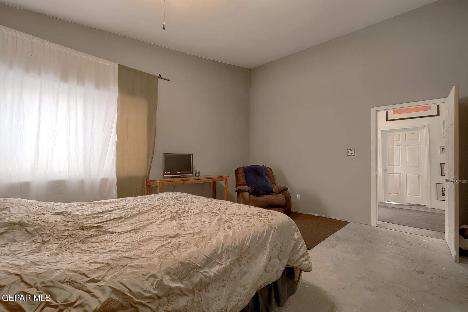 261 Indian Head Road Tornillo, TX 79853 - Photo 23 of 44 a bedroom with a bed and wooden floor