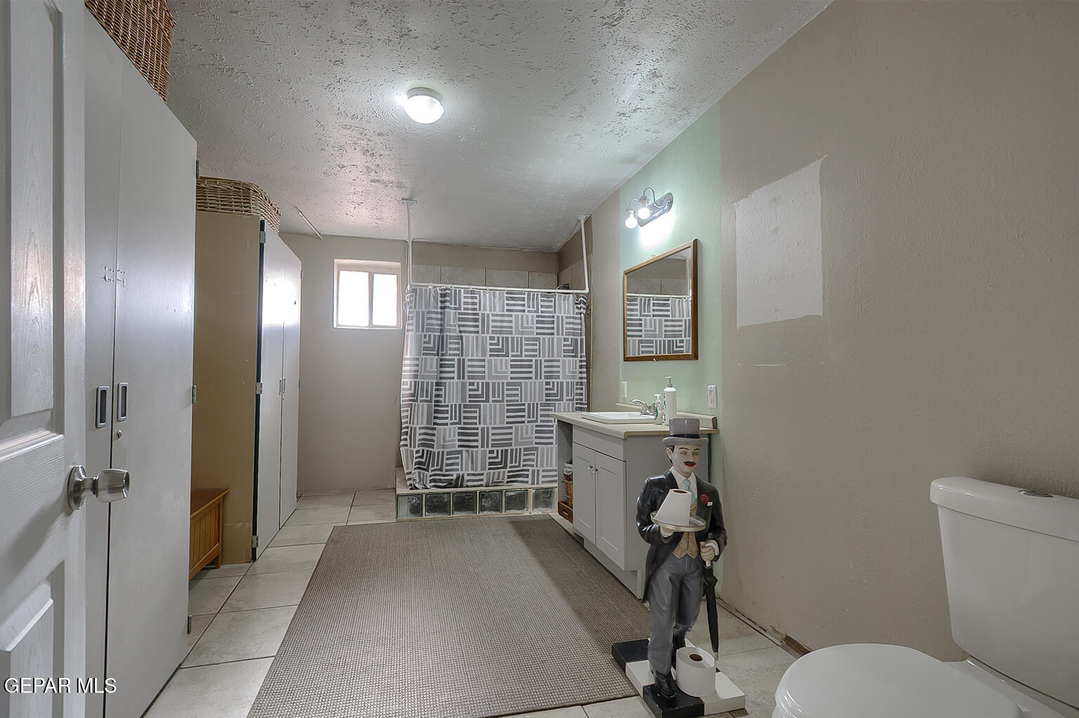 261 Indian Head Road Tornillo, TX 79853 - Photo 29 of 44 a view of a hallway with workspace and a bathroom