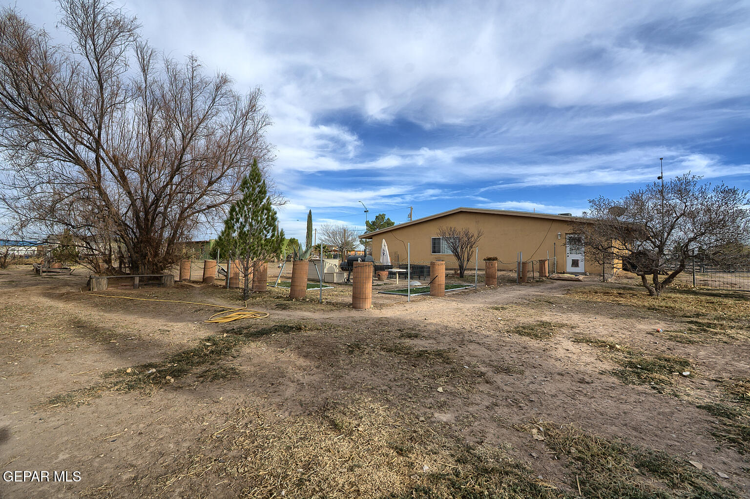 261 Indian Head Road Tornillo, TX 79853 - Photo 37 of 44 a view of a large house with a big yard and large trees