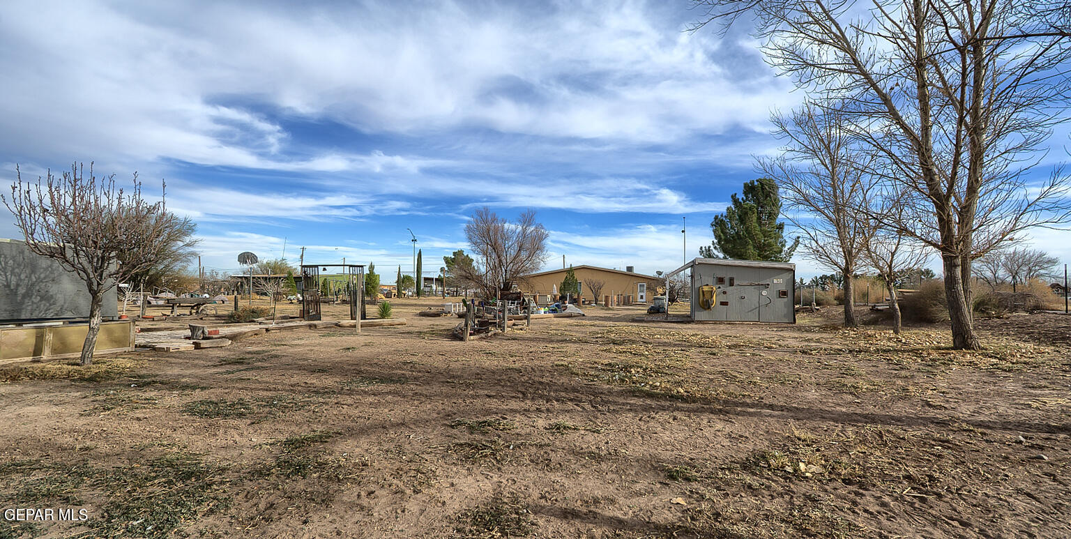 261 Indian Head Road Tornillo, TX 79853 - Photo 38 of 44 a view of a dirt yard with a fountain