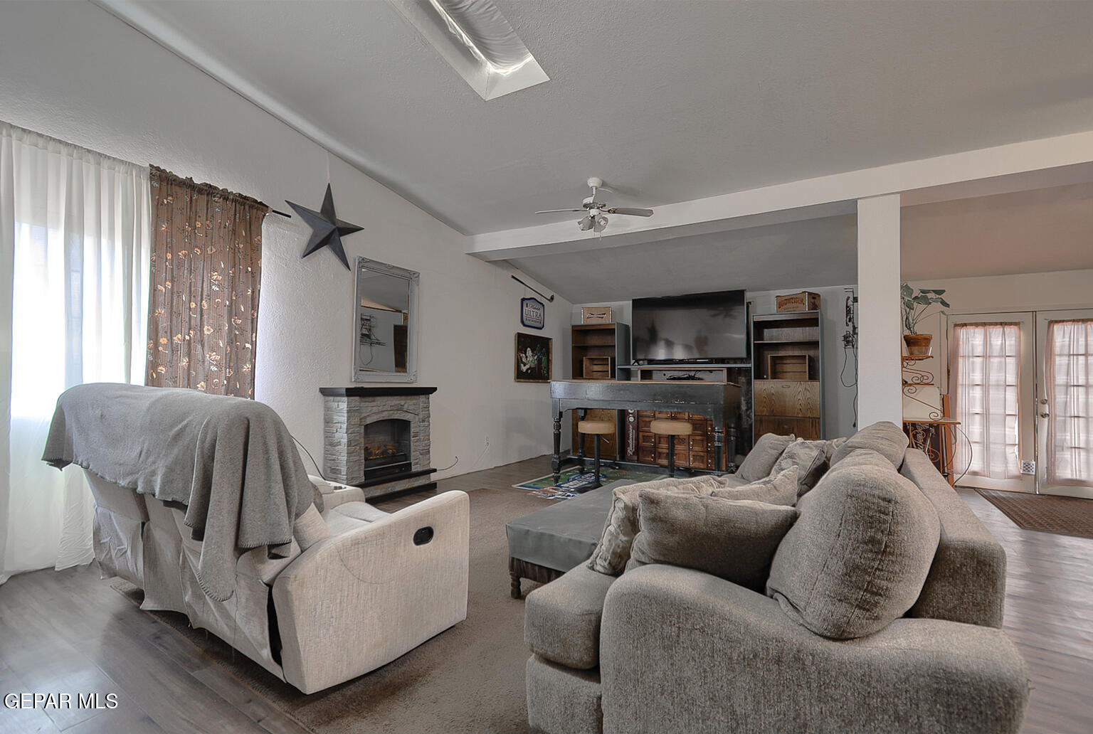261 Indian Head Road Tornillo, TX 79853 - Photo 8 of 44 a living room with furniture and a fireplace