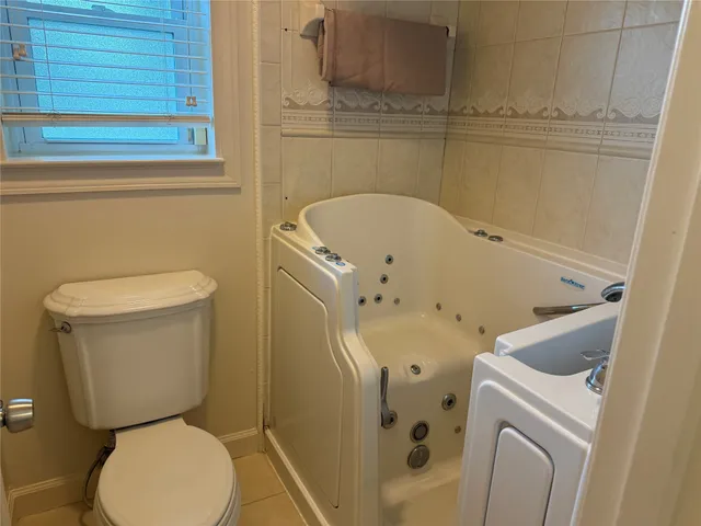 a bathroom with a toilet and a sink