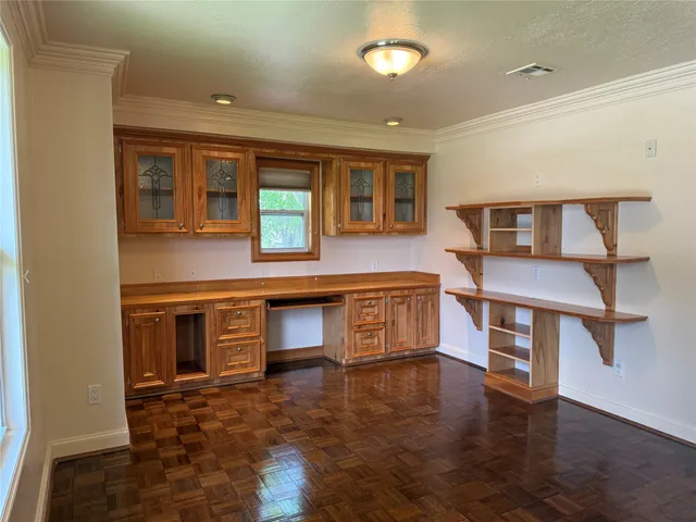 a view of an empty room with a door
