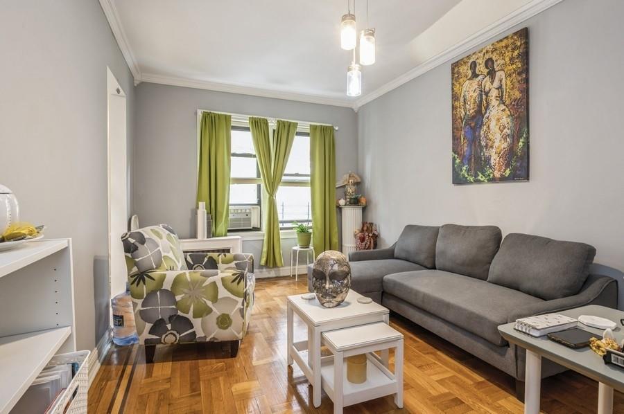 a living room with furniture and a large window