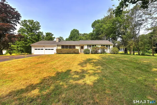 a view of a house with a big yard
