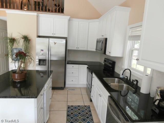 512 Riverview Road Lexington, NC 27292 - Photo 11 of 30 Bright and open kitchen with stainless appliances, new cabinets, and new granite counters!