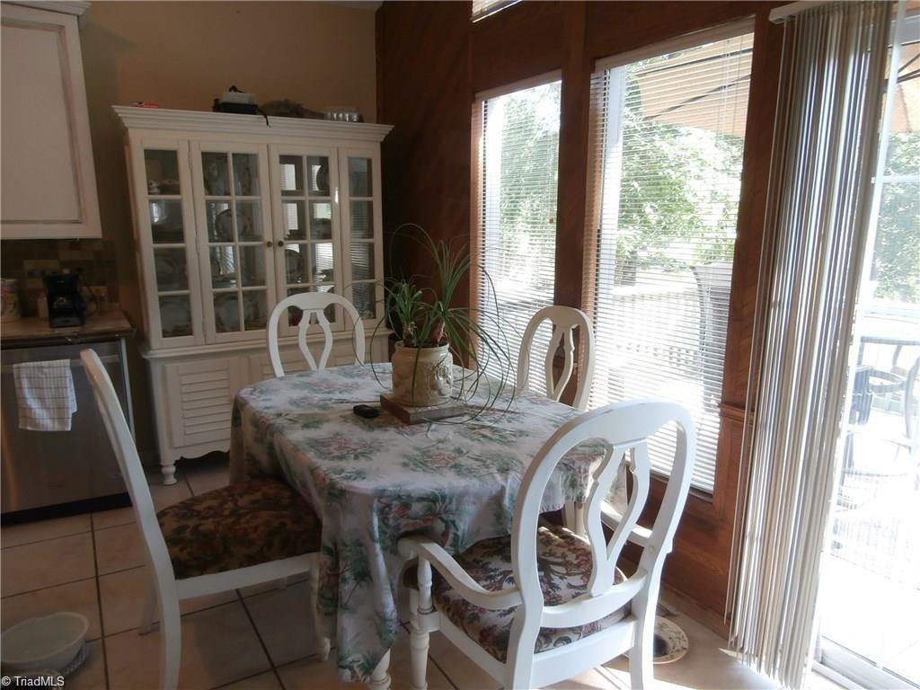512 Riverview Road Lexington, NC 27292 - Photo 13 of 30 Dining area with serene views of the lake