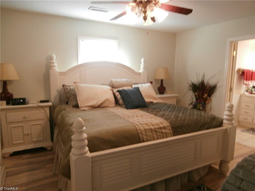 512 Riverview Road Lexington, NC 27292 - Photo 14 of 30 Main level master suite has a private bath with a mirrored double closet.