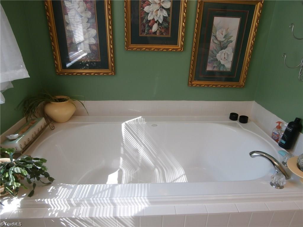 512 Riverview Road Lexington, NC 27292 - Photo 24 of 30 Large garden tub in the upper level full bath. It also has a separate shower.