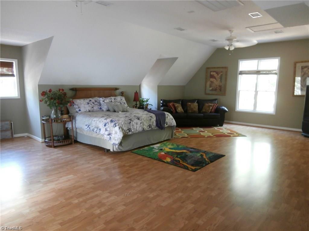 512 Riverview Road Lexington, NC 27292 - Photo 25 of 30 Very large bonus room or UL master bedroom with doors to the upper level deck! Many opportunities for this space!