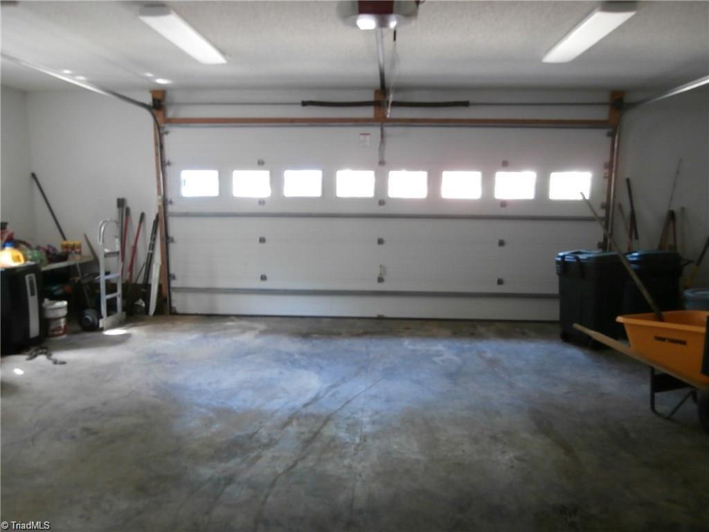 512 Riverview Road Lexington, NC 27292 - Photo 29 of 30 Spacious 2 car garage with insulated doors and a garage door opener. There are stairs in the garage leading to the large upper level bonus room!