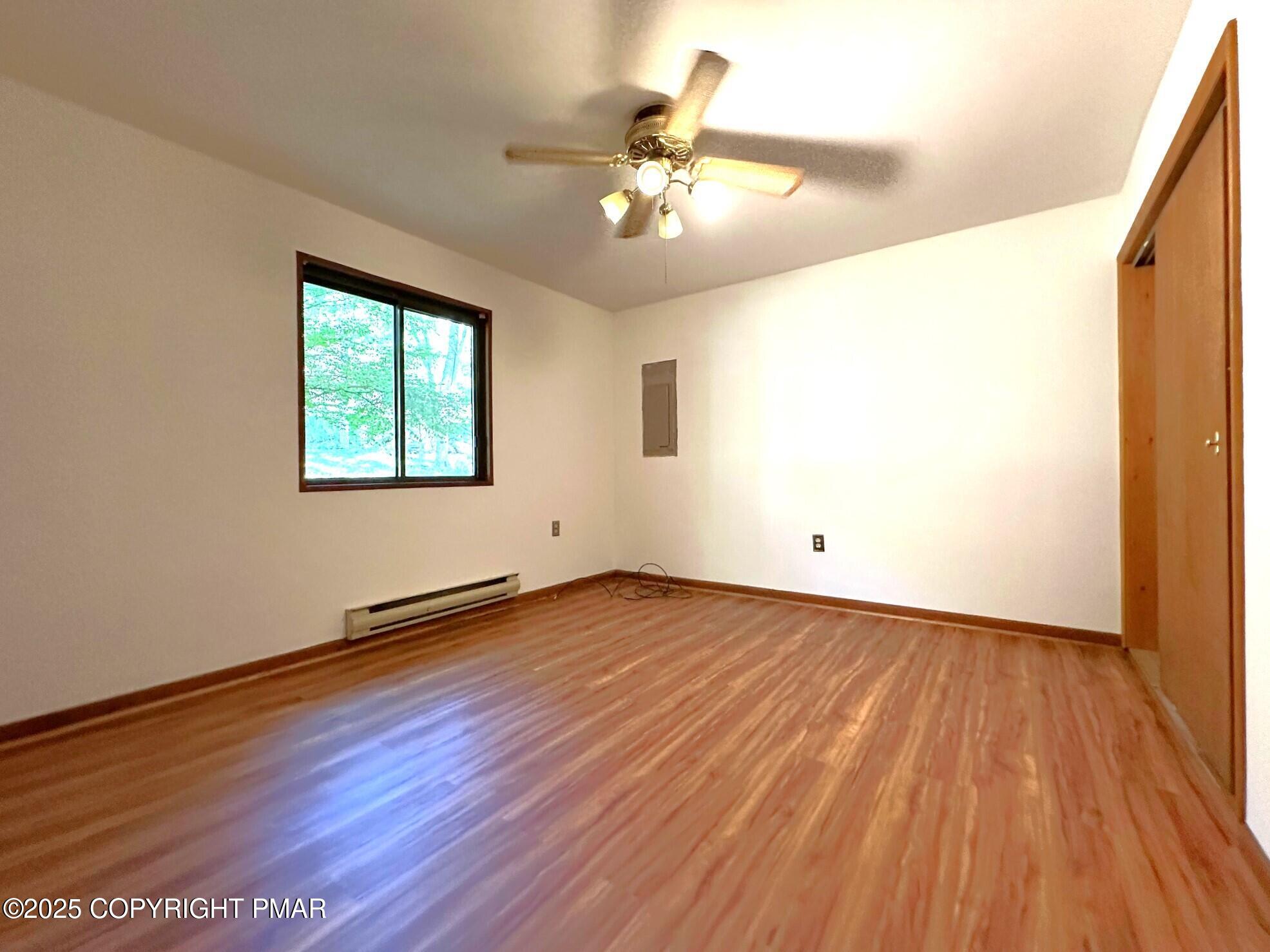 344 Pocono Boulevard, Unit 344 Bushkill, PA 18324 - Photo 14 of 20 wooden floor in an empty room with a window