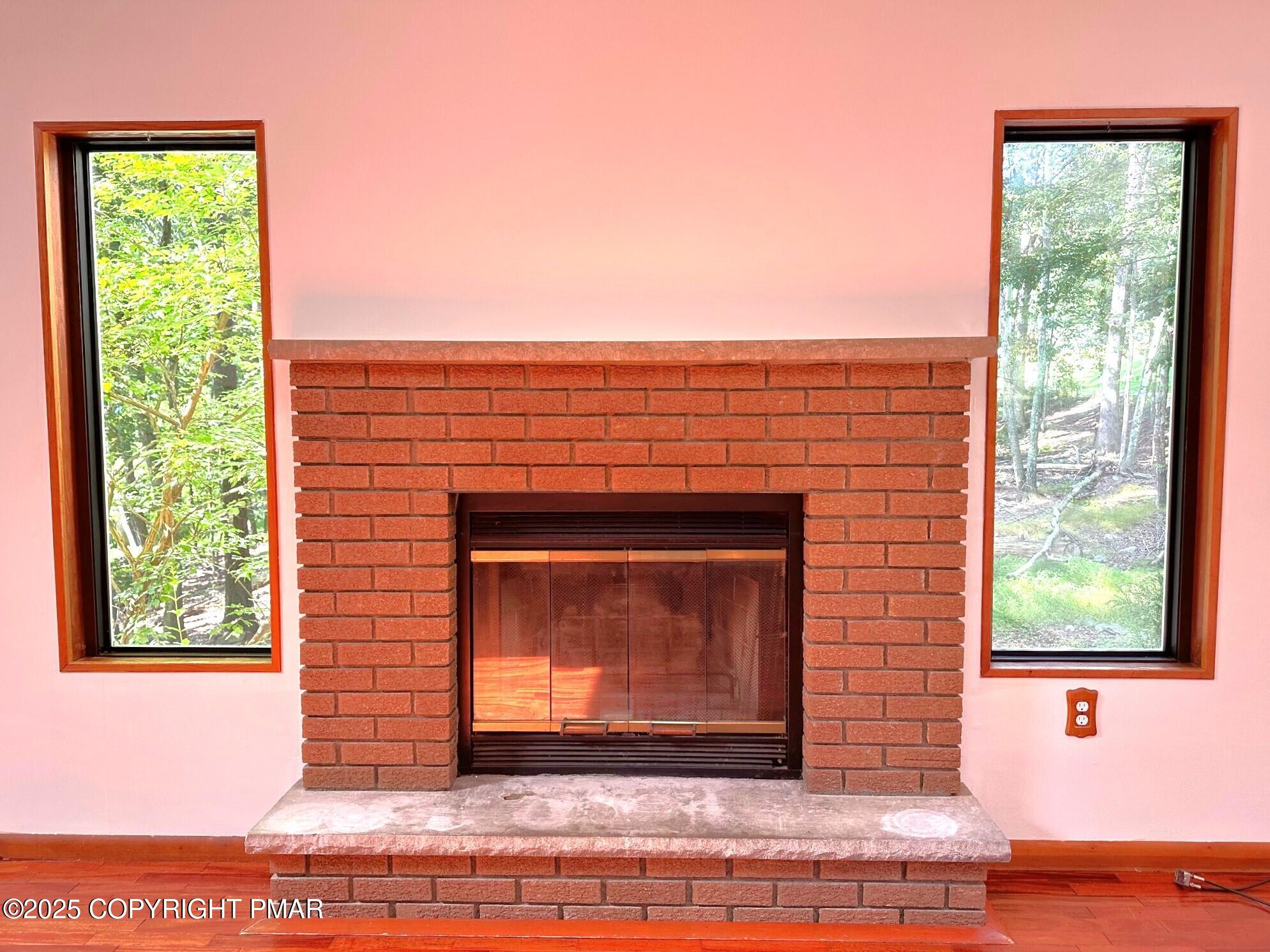 344 Pocono Boulevard, Unit 344 Bushkill, PA 18324 - Photo 3 of 20 a living room with a fireplace