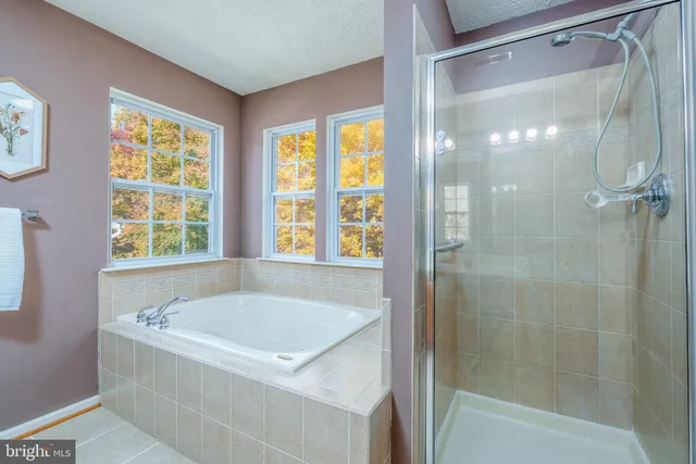 a white bath tub sitting next to a window