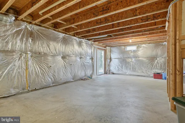 a view of a balcony with furniture and wooden floor