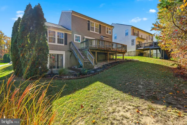 a balcony with table and chairs