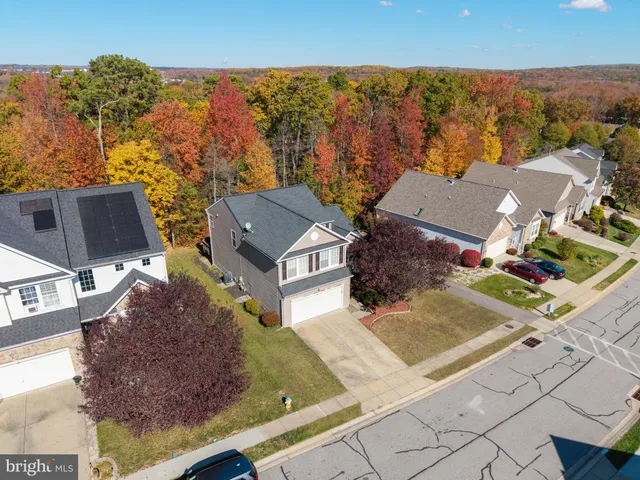 front view of house next to a yard